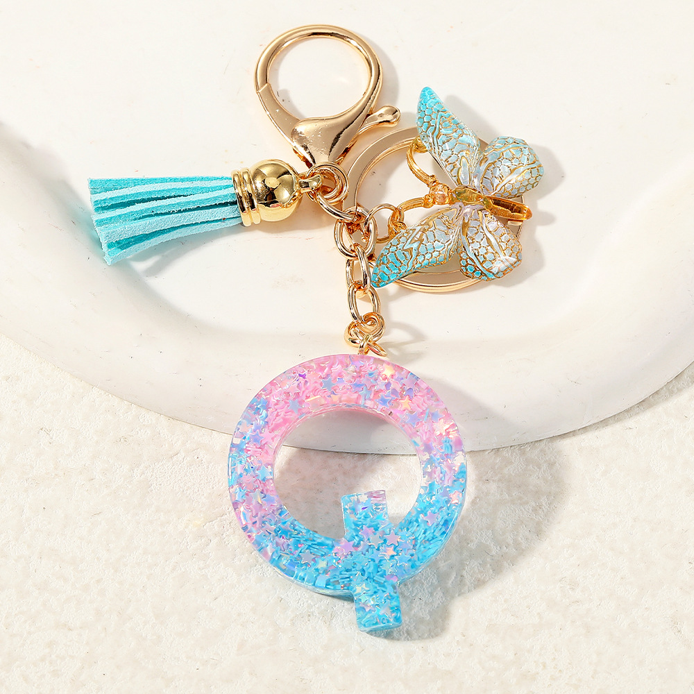 Europa y los Estados Unidos transfronterizos nuevos cristal sequinado goteo de goma letras inglesas joyería llavero y bolsos colgante apoyo al por mayor