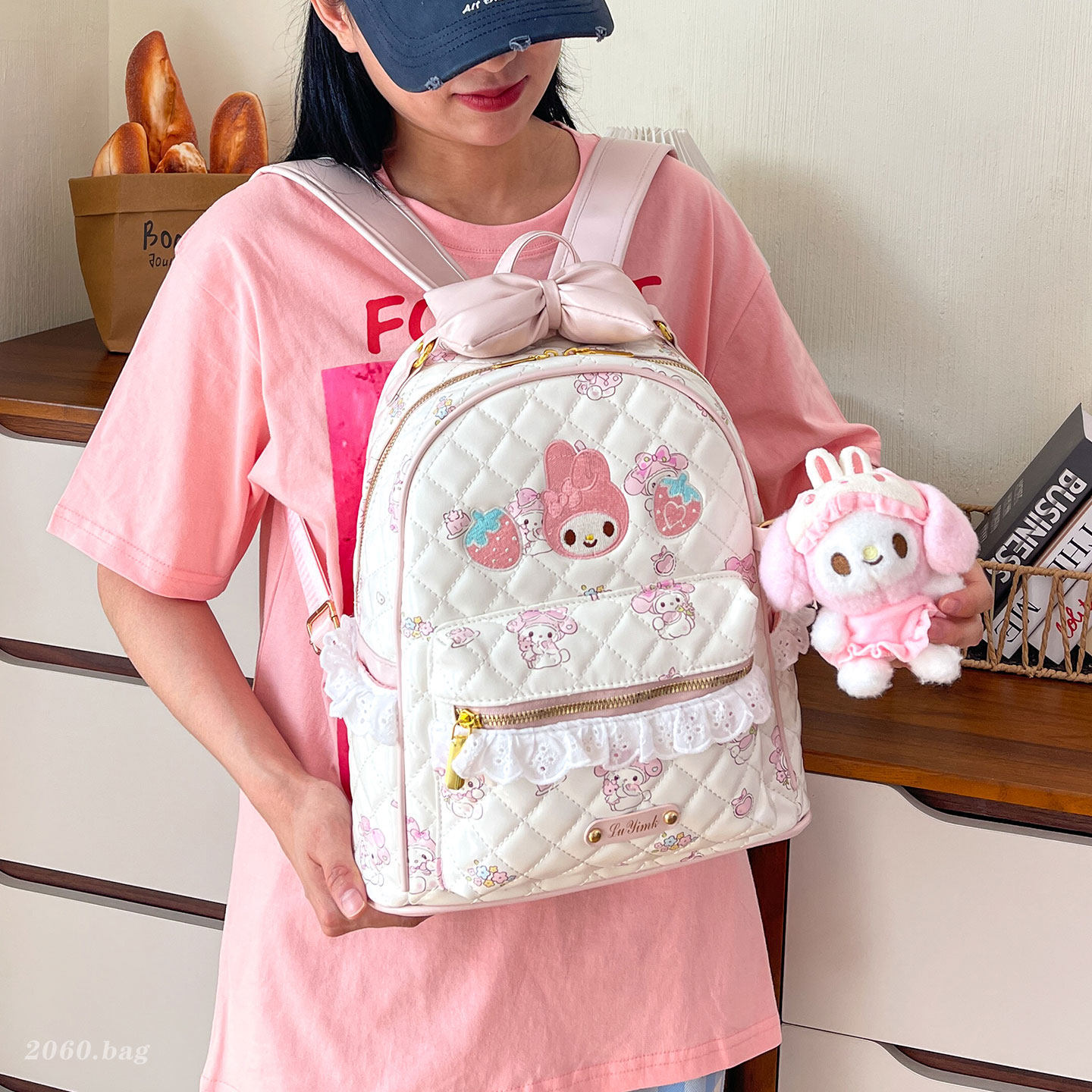 Mochila de gran capacidad 2026 mochila escolar de estilo de mujer de viaje nuevo hombro joven dulce arco estudiante impresión encantadora