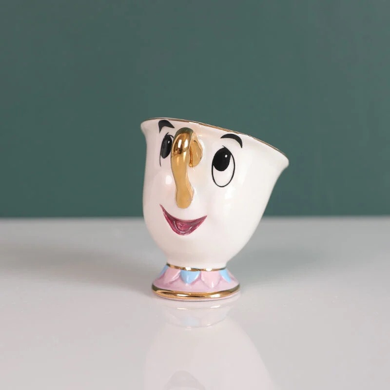 新版のティーポットの美人と野獣のティーポットの陶磁器の金メッキのティーポットのお茶の鍋の奥さんの現物の皿の砂糖の缶|undefined