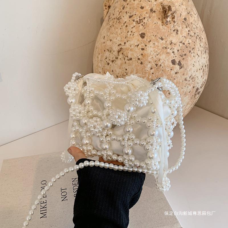 法式小眾設計珍珠小包包女2024夏天新款迷你口紅包洋氣單肩斜跨包