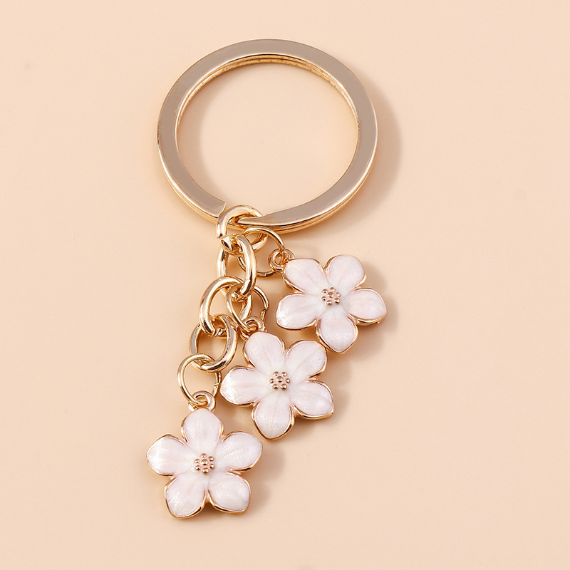 Dulce chica corazón flor de cerezo llavero simple Flor del ciruelo flor teléfono móvil bolso colgante decorativo joyería