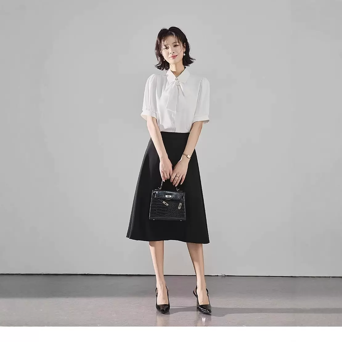 艾轩 黑色面试半身裙女夏薄款西装裙考公气质通勤正装a字中长裙子