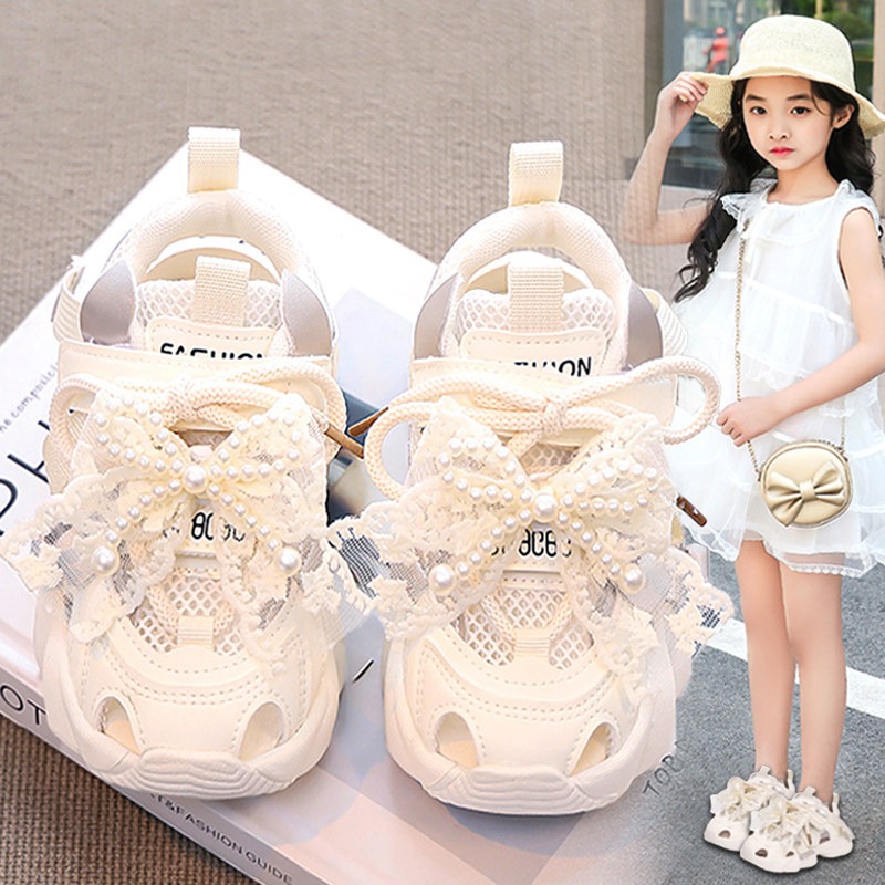 Sandálias de niñas 2026 verano nuevo niño red zapatos deportivos de cabeza de pan niña princesa con suela suave zapatos de red