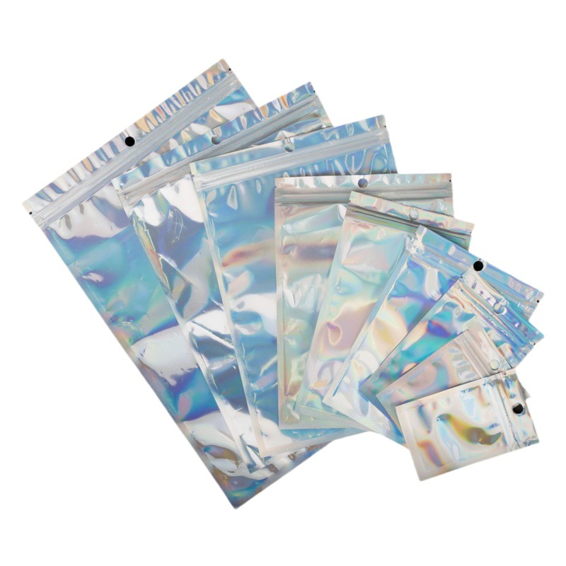 Bolsa láser Yin-Yang Bolsa autosellante Joyería Cosméticos Bolsa sellada transparente de plástico Cable de datos Joyería Bolsa de embalaje al por mayor