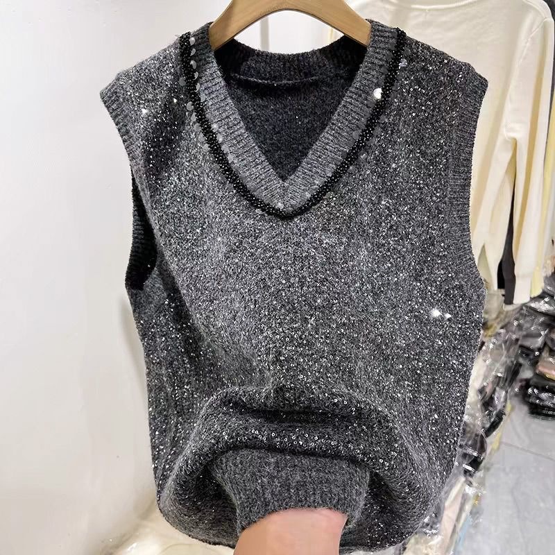 Scissors Stone sequined V-neck knitted vest with black beaded collar and sparkly trim; fashionable gray sleeveless sweater vest.