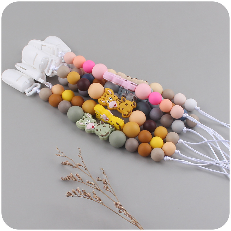 Nuevo bebé suministros chupete cadena creativa de dibujos animados jirafa silicona bebé mordedura cadena anti-caída molar