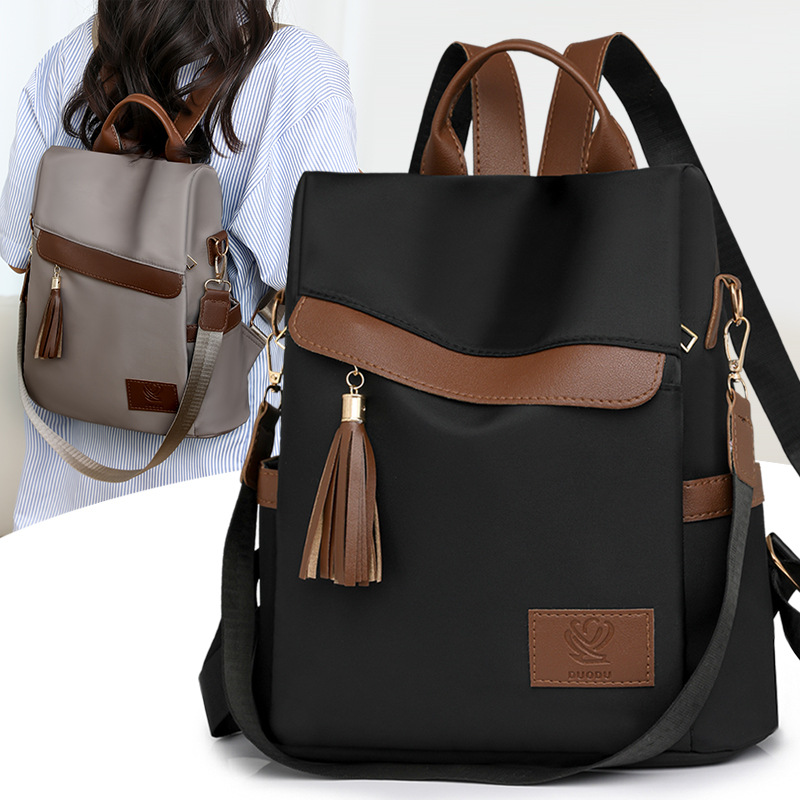 2024 otoño, nueva mochila antirrobo para mujer, borla de moda, color de contraste, nailon, mochila de viaje, mochila escolar, marea