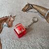 Single key dark red shell (red shaft light tone) - red cap + small d chain