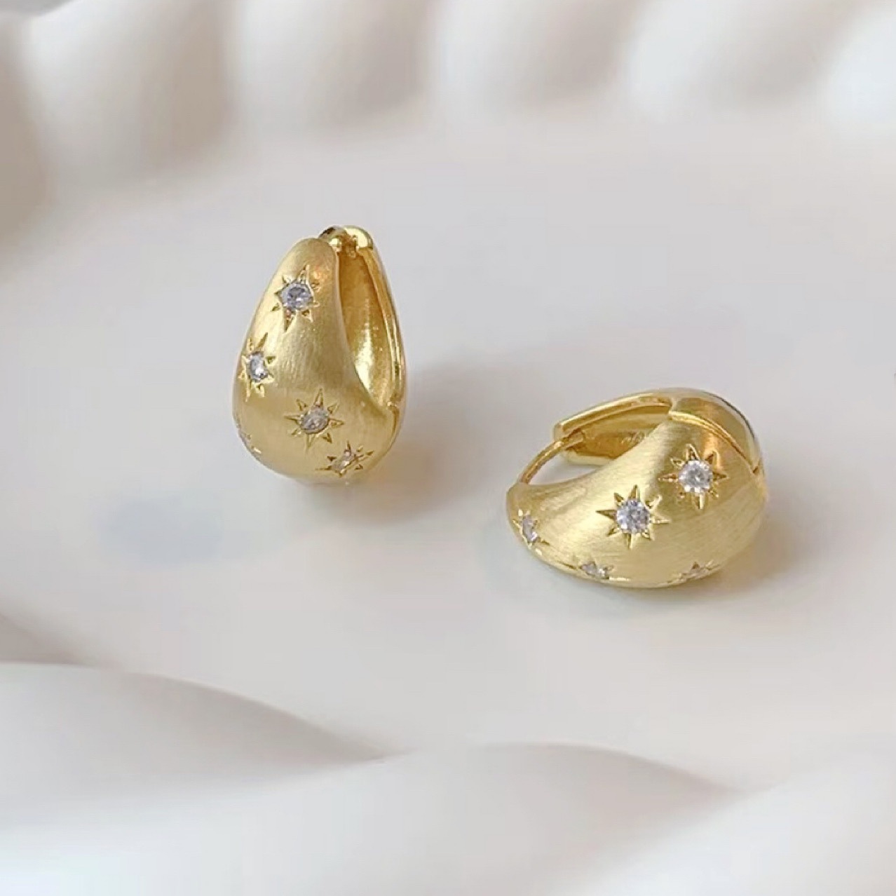 Matte fashionable earrings with zircon