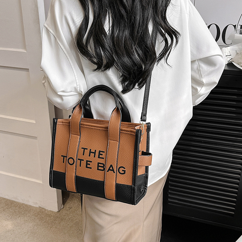Bolso tote de comercio exterior para mujer 2023, nuevo bolso de mano moderno europeo y americano, bolso bandolera con estampado de letras y bloques de color.