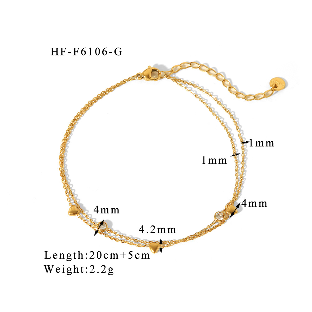 Estilo francés acero de titanio horno de 18K galvanoplastia de oro real doble amor circón tobillera verano femenino todo fósforo joyería de playa