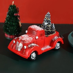 クリスマスの創意的な小さい車は赤いカートの樹脂の工芸品の家庭を飾ってクリスマスの祝日の贈り物を飾ります。