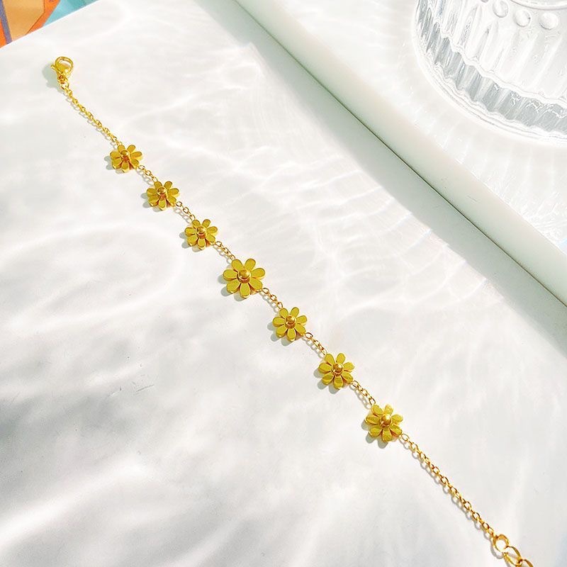 2022 nuevo oro pequeño Zou Ju tobillera ajustable japonés y coreano hembra titanio acero nicho siete flor tobillera hembra