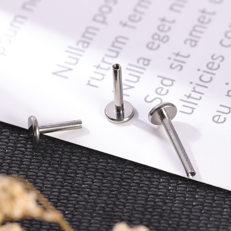 Silver pointed spike labret stud material detail