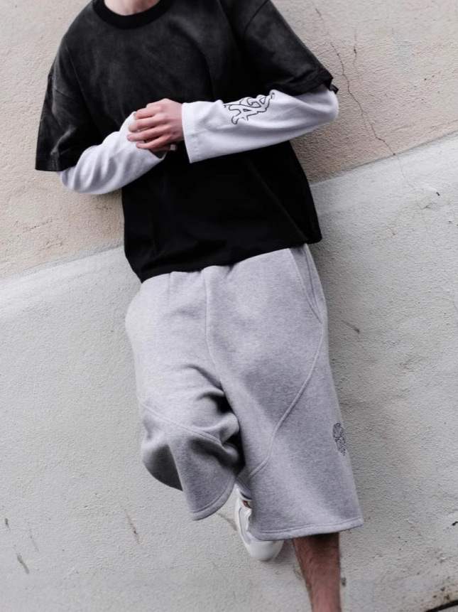 Europeos y estadounidenses bordados transfronterizos pantalones de cinco puntos, pantalones casuales para hombres y mujeres, pantalones cortos de moda relajados hip-hop retro americanos