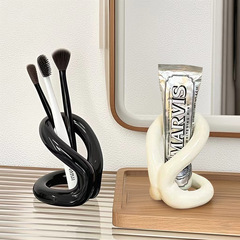 現代のシンプルな結び目シリーズの陶磁器の歯ブラシの棚の物棚のカップルのトイレの歯具の歯磨き粉の装飾の収納棚