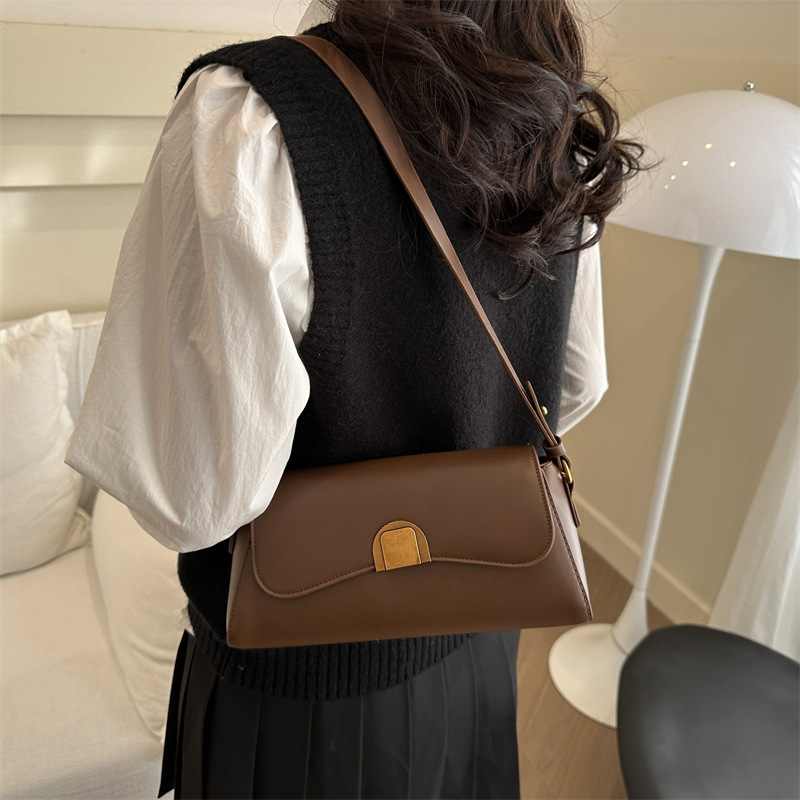 Bolso de brazo retro de palo para mujeres 2025 nuevo nicho de moda de alta sensación bolso de hombro universal bolso de mochila
