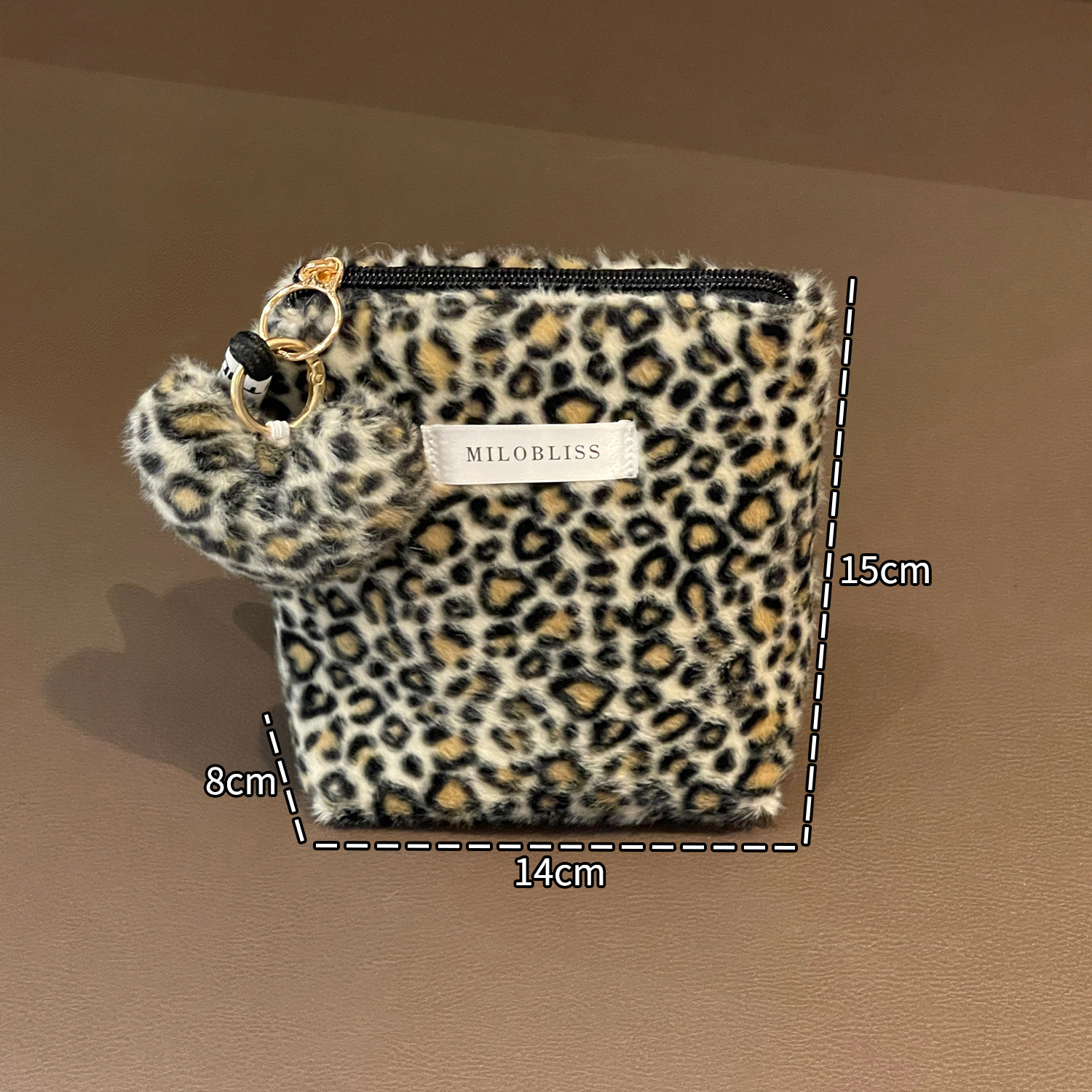 Nueva bolsa de maquillaje impresa de leopardo de peluche de pelo de conejo multifuncional portátil otoño y invierno para salir bolsa de almacenamiento de lavado de gran capacidad