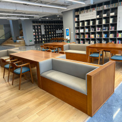 創意的な幼稚園の貯蔵物のソファーは腰掛け図書館の本棚のアイデアのアーチ形の多機能の休憩エリアの腰掛けのソファーに座ります。