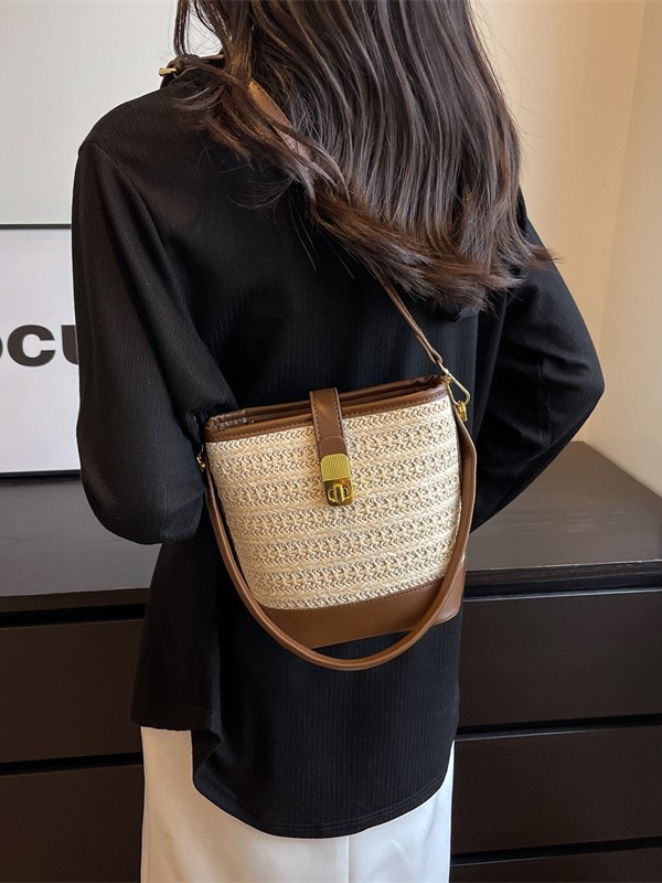 Bolso de nicho coreano bolso de cubo de tejido de mano para mujeres verano 2026 nuevo color de contraste de textura alta bolsa de mochila