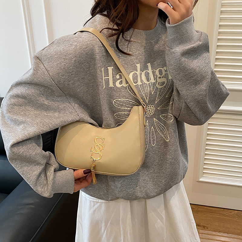 Bolso de hombro retro coreano primavera / verano 2024 nueva moda bolso de hombro de moda bolso de media luna de mujer