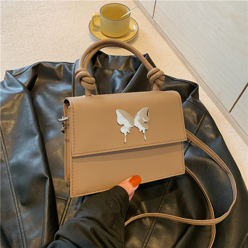 Diseño de nicho de lujo ligero bolso de mano de este año popular arco decoración de viaje diario mochila de hombro para mujeres