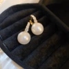 Golden white earrings