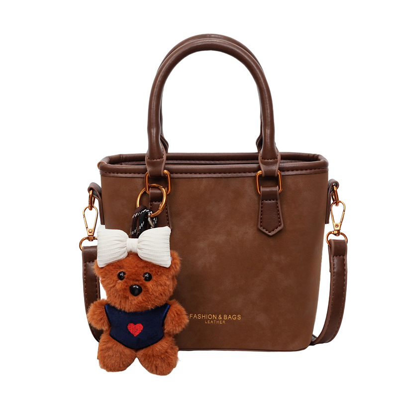 Bolso de mano esmerilado transfronterizo 2025, nuevo invierno popular bolso de cubo de moda de mujer bolso de hombro de estilo extranjero mochila