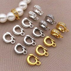 本物の金をメッキして、ジルコンの万能ボタンを入れます。