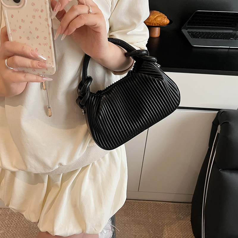 Versión coreana del bolso de nicho 2025 verano nuevo bolso femenino bolso de hombro fresco simple bolso de mensajero a rayas de moda