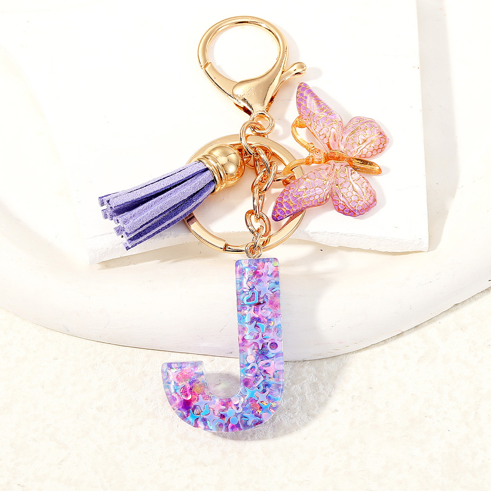 Mayorista transfronterizo mariposa esquinilla iniciales llavero de cristal goteo llavero de letras bolsos colgante