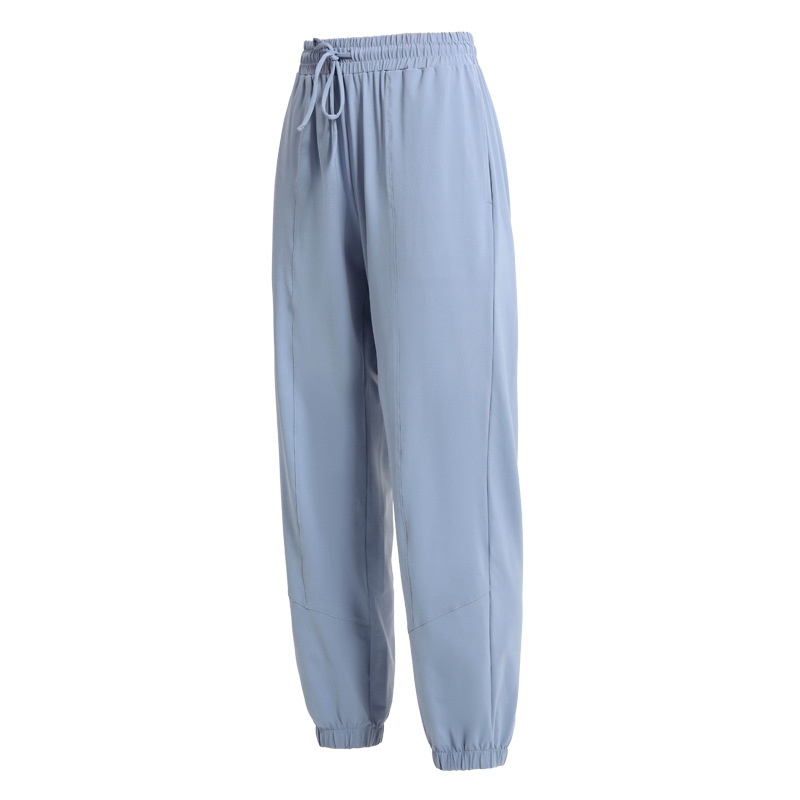 Pantalones deportivos europeos y americanos pantalones largos de protección solar para mujeres con cordón para adelgazar polainas sueltas Otoño e Invierno nuevos deportes más pantalones de Yoga de tamaño