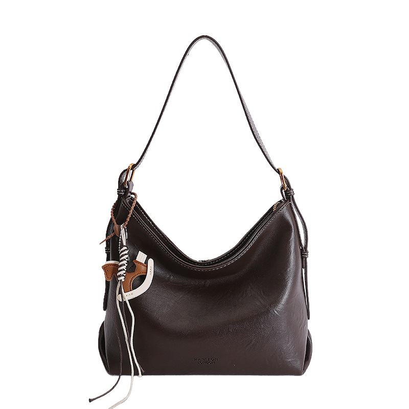 Alta sensación de gran capacidad de viaje bolsa de mano para mujeres Europa y América textura nicho de moda simple universal bolsa de hombro