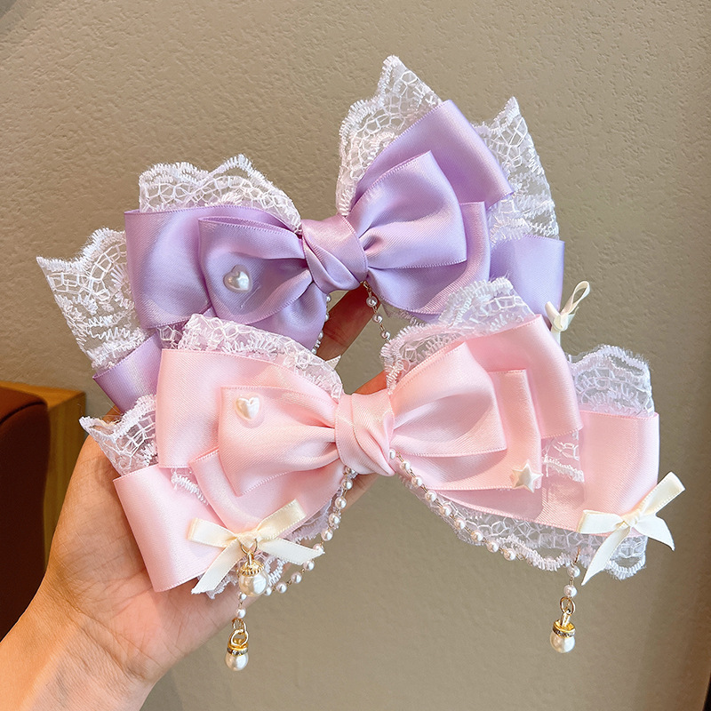 Cute children's hair accessory with bow pearl with tassels