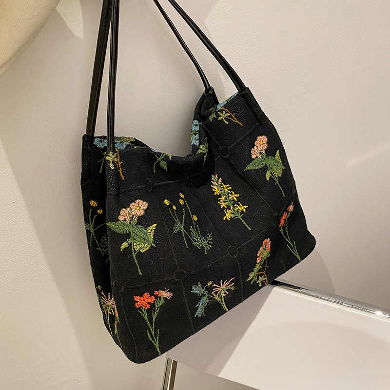 Bolso de mano bordado de gran capacidad para las mujeres 2024 primavera y verano nuevo nicho lienzo bordado bolso de cubo de cercanías
