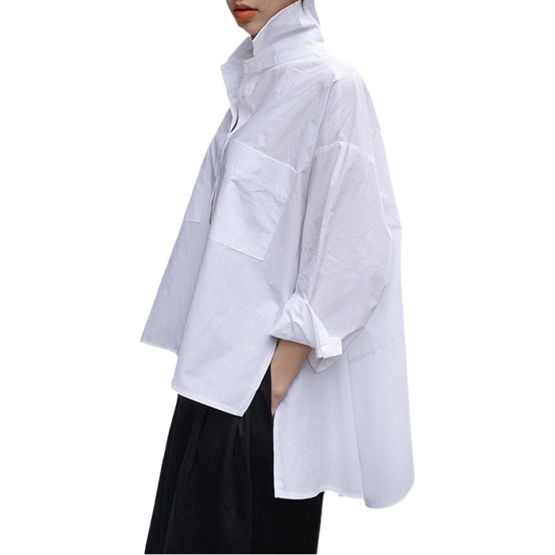 春秋の服の新型の白いシャツの女性の韓国版のゆったりしている大きいサイズのマント型の長袖の不規則なシャツのファッション的な上着
