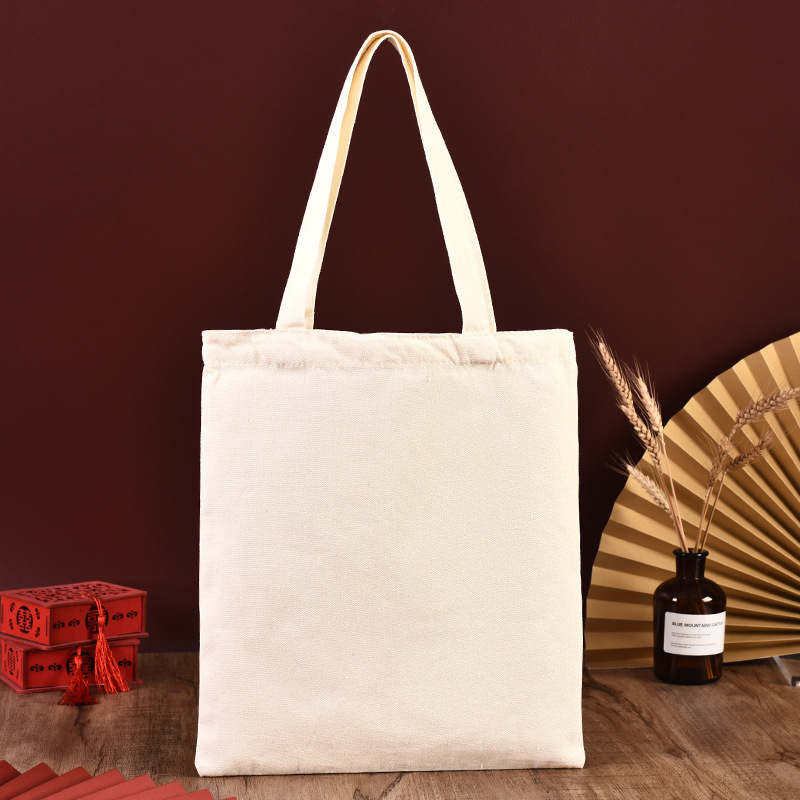 En stock bolsa de lona portátil en blanco personalizable logotipo de impresión en color de un solo hombro bolsa de compras bolsa de algodón de entrenamiento publicitario