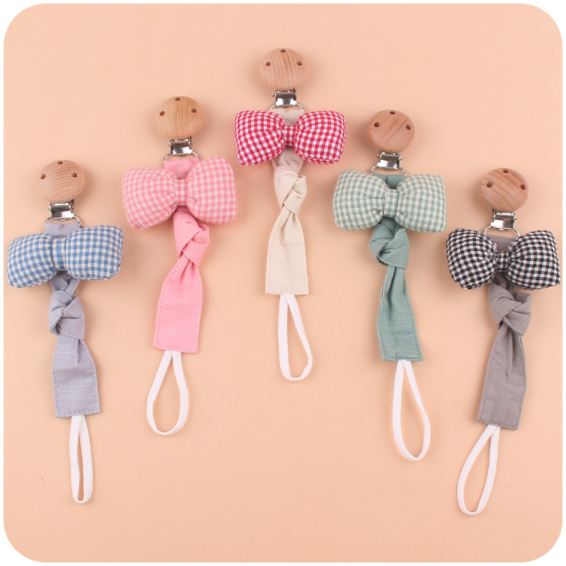 Nuevo bebé suministros clip de chupete de haya calmante bebé Arco-Nudo algodón y lino cinta chupete cuerda chupete cadena