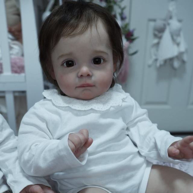 58cm simulación bebé renacido muñeca Maggi cuerpo de tela muñeca nicho transfronterizo suministro entrega de una sola pieza