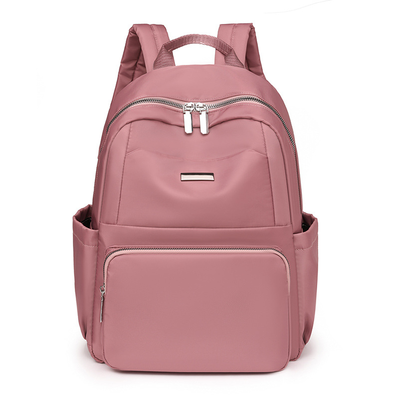 2024 verano nuevo estilo casual damas mochila de nailon simple y versátil mochila de computadora de gran capacidad para estudiantes al por mayor