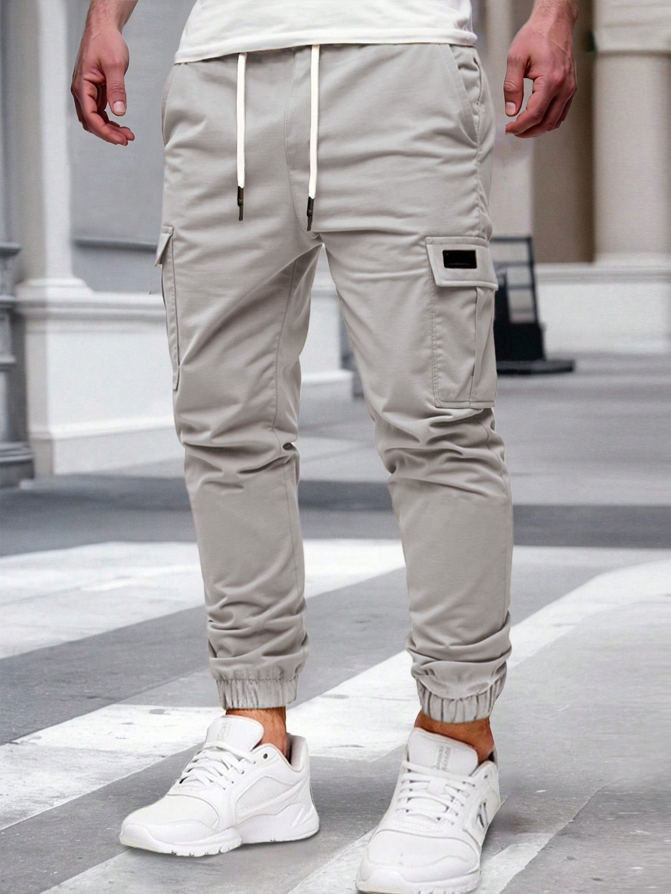 Nuevos pantalones de estilo europeo transfronterizo de hombre de bolsillo multi-bolsillo, pantalones de estilo de moda de comercio exterior.