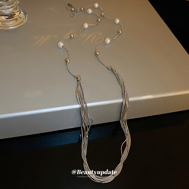 Luz de lujo largo multicapa apilados collar de perlas Otoño e Invierno versátil suéter clavícula cadena nicho de alta calidad accesorios al por mayor