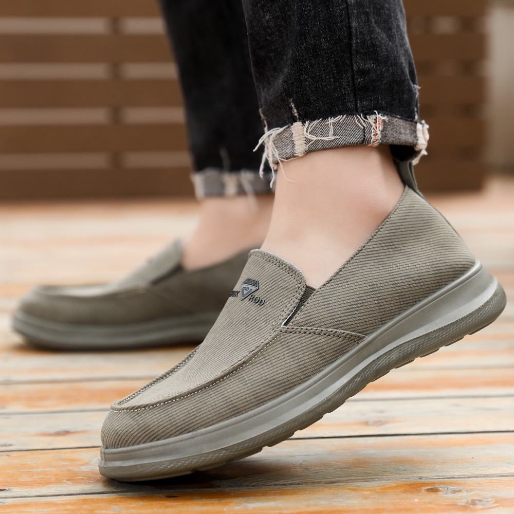 Zapatos de hombre primavera nuevos zapatos casuales cómodos de un pie zapatos de lona transpirables de suela suave zapatos de papá al por mayor