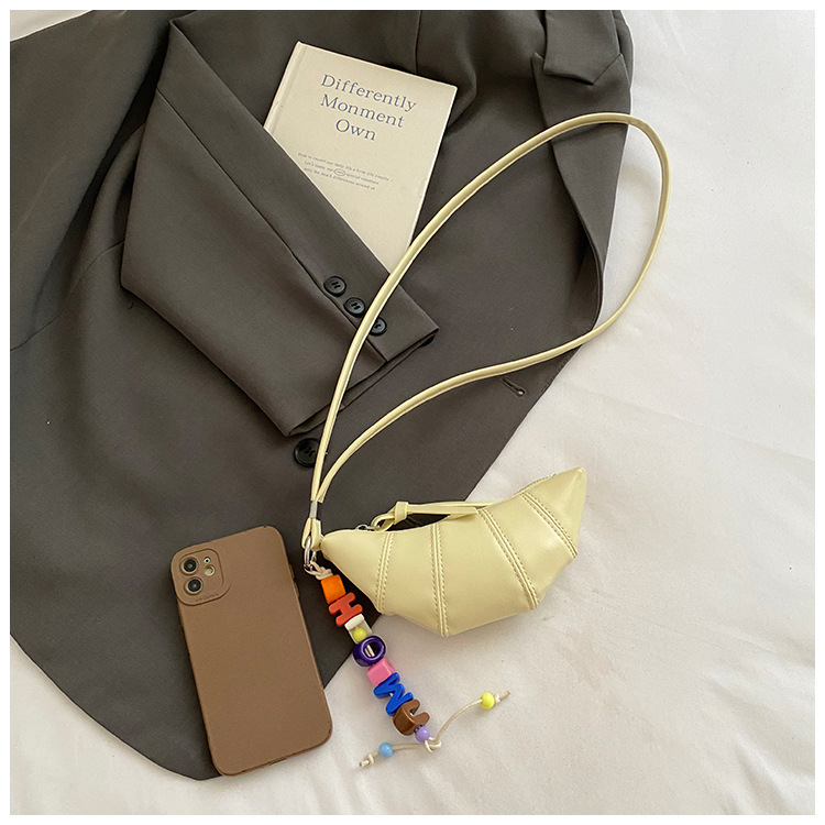 The cute horn bag with a niche neckline design is fashionable and trendy. The mini crossbody bag is in a solid color, simple and elegant with a high-end texture Item Picture