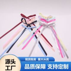 現物の0.6センチの幅の長いリボンの蝶結びの諸及びネットの赤い靴下の蝶結びの部品の服装の補助材料