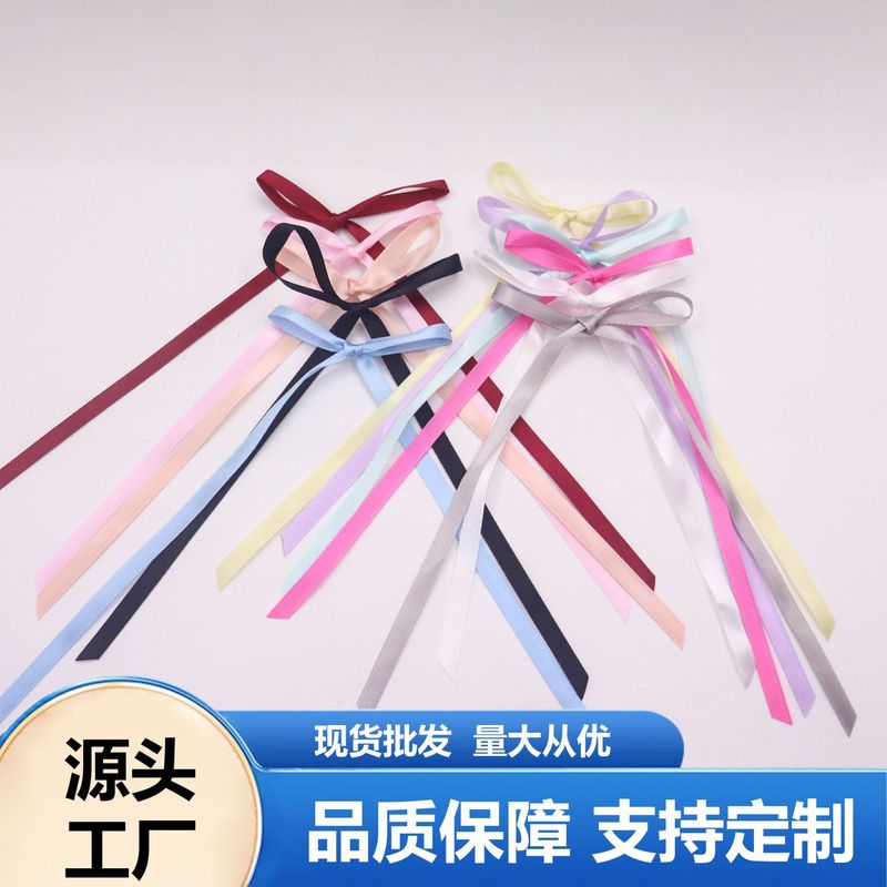 現物の0.6センチの幅の長いリボンの蝶結びの諸及びネットの赤い靴下の蝶結びの部品の服装の補助材料|undefined