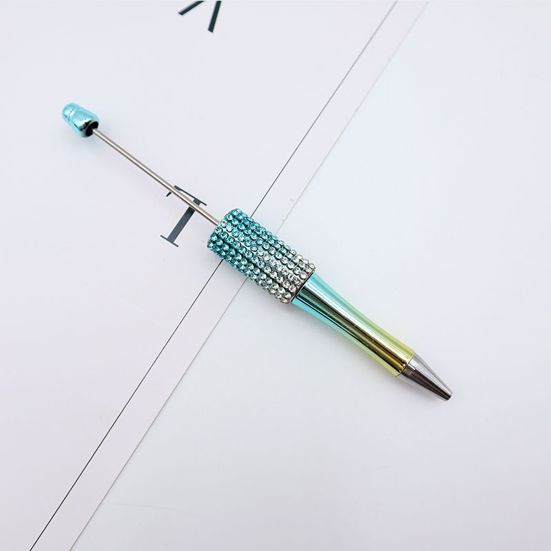 Bolígrafo giratorio de grano lindo de color degradado de tendencia de alto valor Bolígrafo de gomas galvanizado con cuentas de diamantes de bricolaje creativo