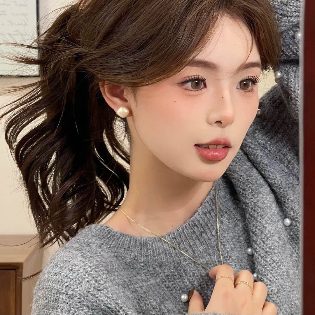 Pendientes de aleación Pendientes de alta calidad de perlas para mujer Pendientes exagerados de temperamento de lujo ligero coreano Pendientes largos con borlas al por mayor