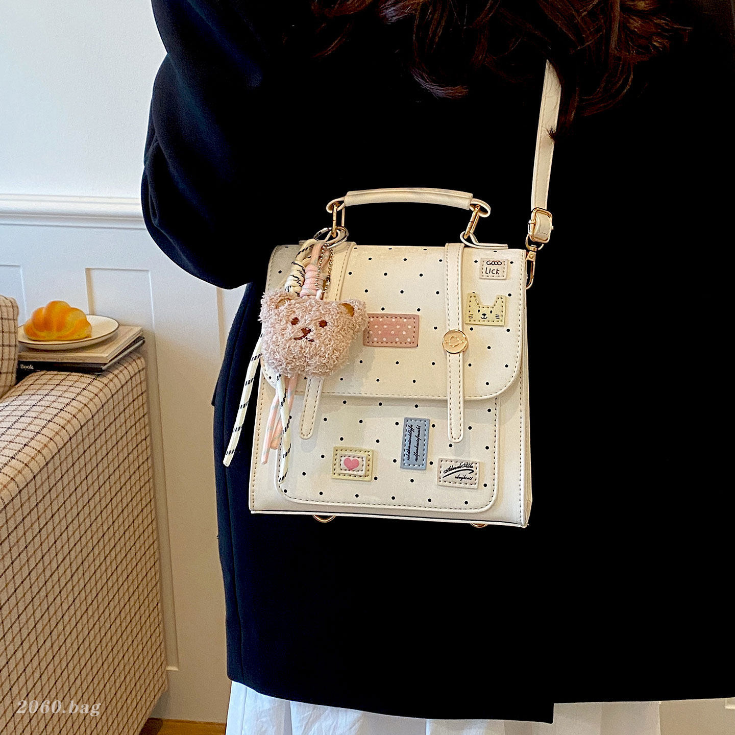 Mochila dulce chica de viaje universal clase de moda de punto de onda mochila de viento diaria 2026 nueva universidad femenina