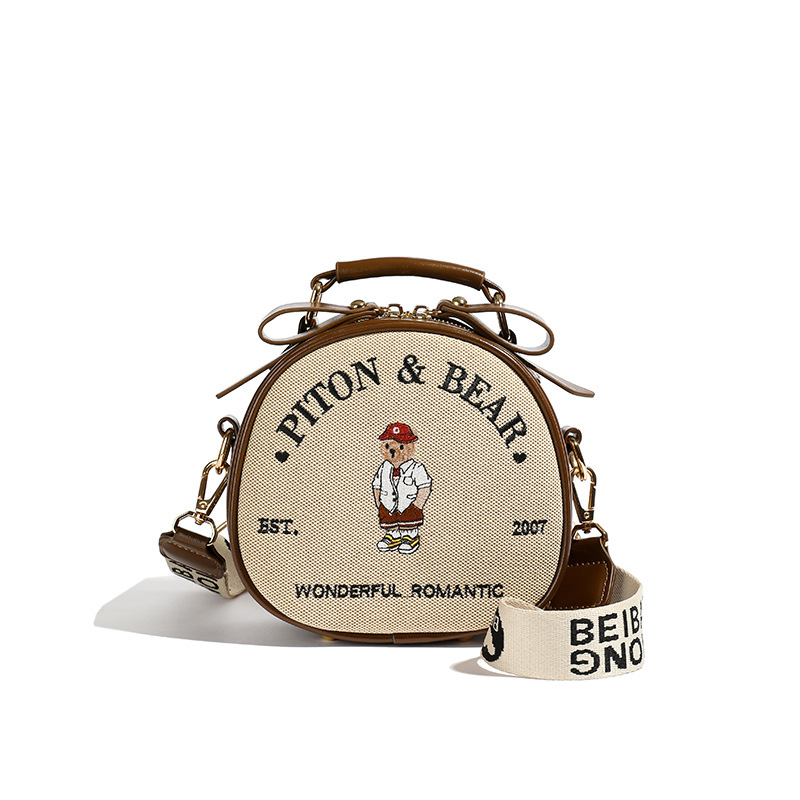 2024 새로운 노스 백 오리지널 디자인 패션 캔버스 모든 경기 자수 곰 어깨 크로스 바디 휴대용 라운드 팬케이크 가방